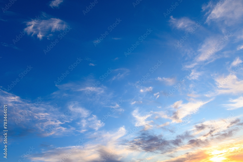 Pastel light cirrus clouds in the blue sky during dawn sunset sunrise, sky background 2