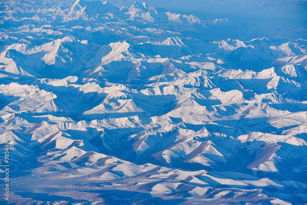 Aerial view of snow capped mountains in Sichuan and Tibet, China Aerial view of snow capped mountains in Sichuan and Tibet, China