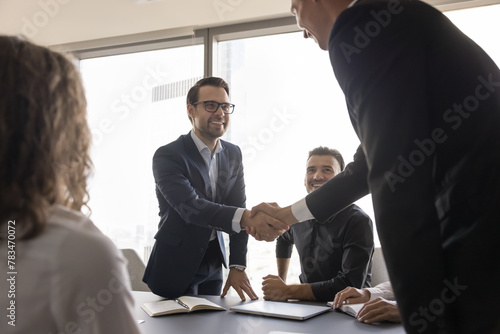 Happy successful businessmen handshake, make commercial deal, fulfill obligations, agreement between parties, integrity and reliability, beginning of partnership or collaboration, succeed common goals