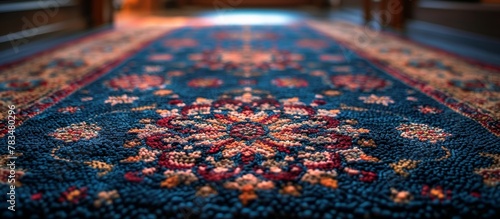 Close-up view of a vibrant blue carpet featuring a striking red border design
