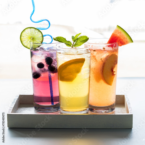 Cool and refreshing fruit flavoured spritzers, ready for drinking. photo