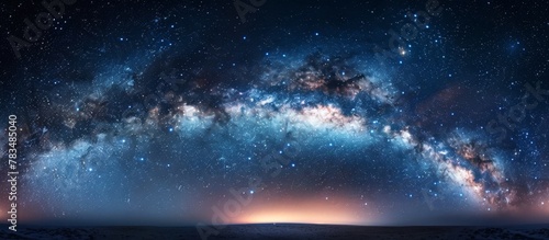 The breathtaking view of the milky way and numerous stars twinkling in the dark night sky