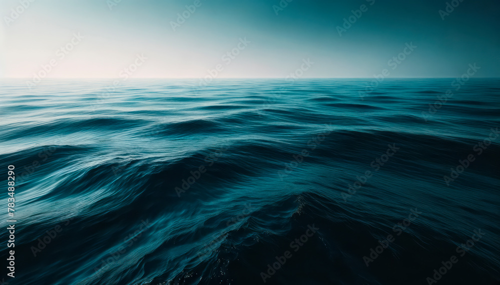 Obraz premium A dark and serene ocean landscape showing gentle waves, with a creative concept on a gradient blue background. Generative AI