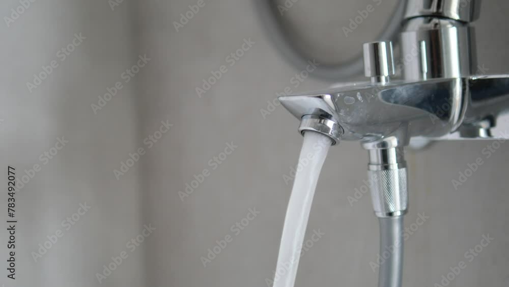 water pouring from a faucet tap slow motion water pouring from a faucet tap slow motion