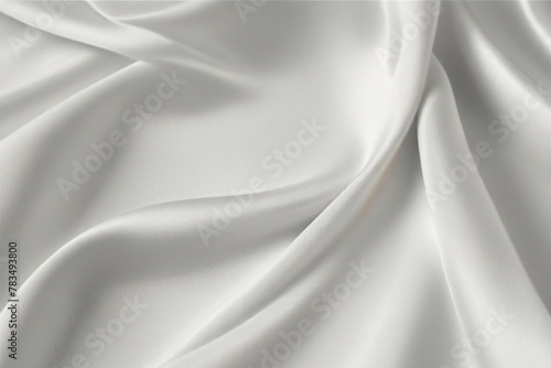 luxury cloth with drapery and wavy folds of ivory color creased smooth silk satin material texture. photo