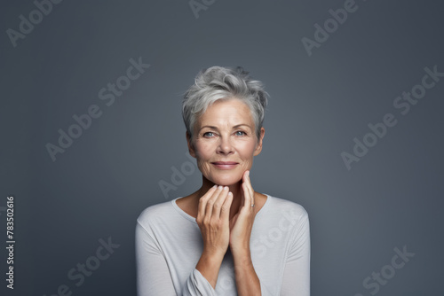 Studio portrait of an elderly beautiful, healthy woman. Lady skin and face care procedures. Concept of health, rejuvenation, plastic surgery and wellness. © Acronym