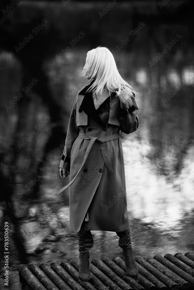 Portrait of a young beautiful blonde girl outdoors. Black and white photo. Portrait of a young beautiful blonde girl outdoors. Black and white photo.