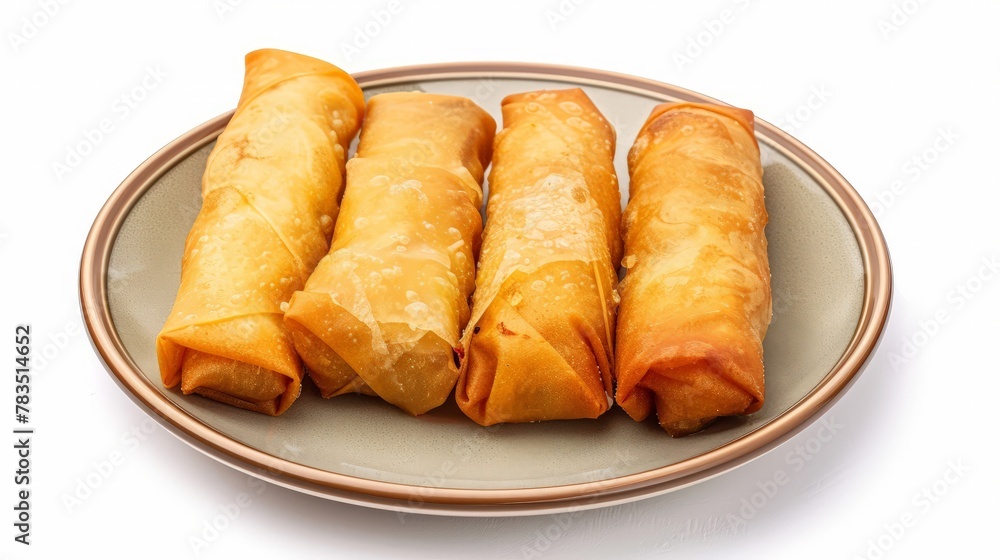 Fried spring rolls on a plate isolated on white background. Fried spring rolls on a plate isolated on white background.