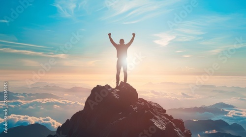 Silhouette of businessman celebrating raising arms on the top of mountain with over blue sky and sunlight.concept of leadership successful achievement with goal,growth,up,win and objective target. photo
