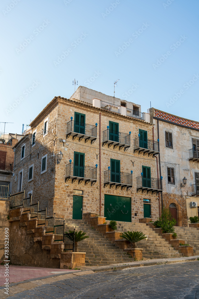 Pietraperzia, Sicily, Italy. House with cones on the balconies. Summer sunny day