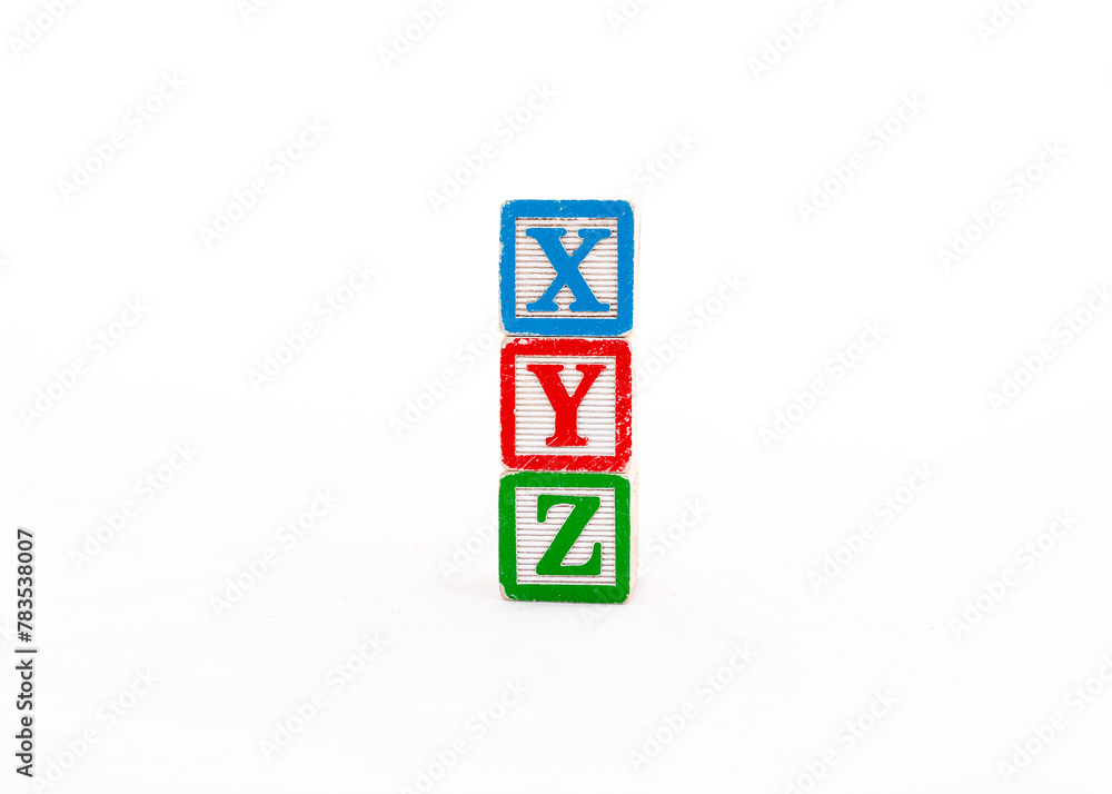 XYZ alphabets letters written on wooden cubes isolated on white background XYZ alphabets letters written on wooden cubes isolated on white background