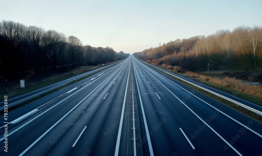 An empty highway or autobahn with no cars on the road, depicting a driving ban scenario An empty highway or autobahn with no cars on the road, depicting a driving ban scenario