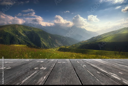 Colorful place in the caucasus mountains. Beautiful outdoor scene with empty wooden table. Natural template landscape photo