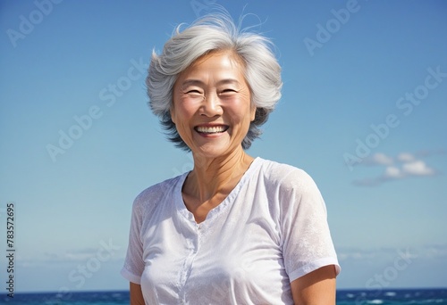 Senior Asian woman smiling in bright colours 