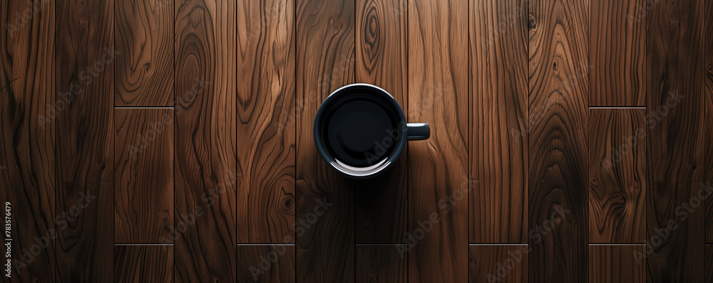 Top view of a black coffee cup on a polished wooden table, a minimalist composition with rich, dark textures.
Top view of a black coffee cup on a polished wooden table, a minimalist composition with rich, dark textures.