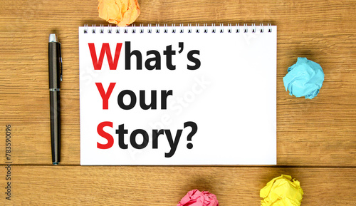 Storytelling and what is your story symbol. Concept words What is your story on beautiful white note. Beautiful wooden table background. Business storytelling what is your story concept. Copy space.