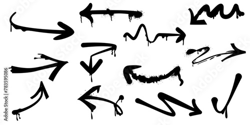 Graffiti arrows. Black arrows painted with a spray can, set.