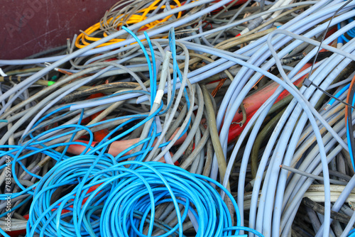 container with coils of old copper and PVC electrical cables for separate waste collection and material recycling in the recycling center