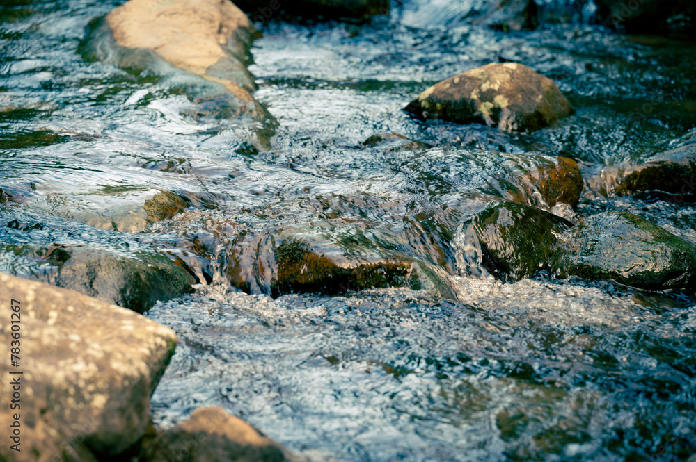 Fototapeta premium Close up of water flowing through the rocks on the river, shoot in long lens, in Nuandong Valley, Keelung city, Taiwan.