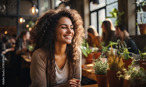 Woman Sitting at Table With Potted Plants