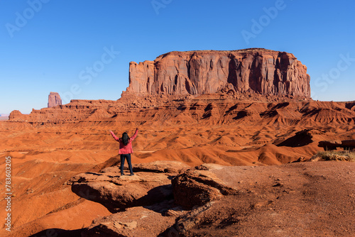 A tourist woman travels in Monument Valley in USA . Embracing Majesty, Utah/Arizona, USA