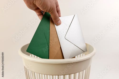 Paper envelopes are thrown into the trash. Paper recycling.