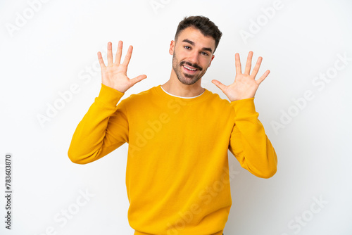 Young caucasian man isolated on white background counting ten with fingers