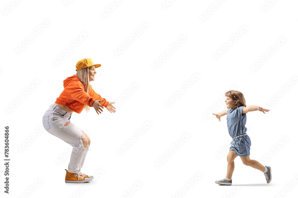 Full length profile shot of a little girl running towards a young female with arms wide open - obrazy, fototapety, plakaty 