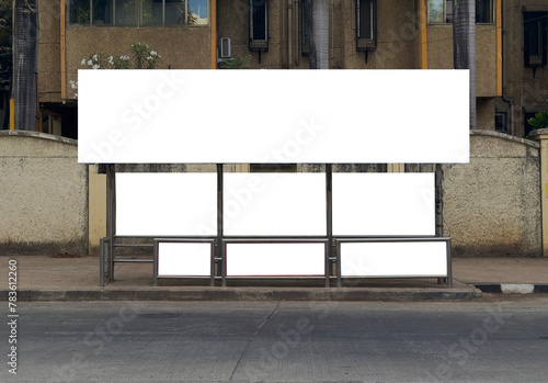 A front view of bus stop in Mumbai, India with blank empty place for commercial banner mockup billboard, ooh, outdoor. Indian bus stop mock-up for branding. A complete bus stop for advertising.
