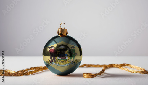 A Christmas tree ornament featuring the Delaware flag, symbolizing holiday cheer and patriotic spirit