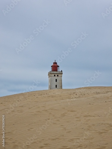 Famous Rubjerg Knude Lighthouse on the dunes in Denmark © Wirestock