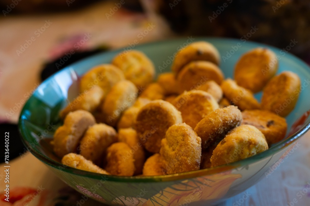 Closeup shot of a bowl with small cookies in it Closeup shot of a bowl with small cookies in it