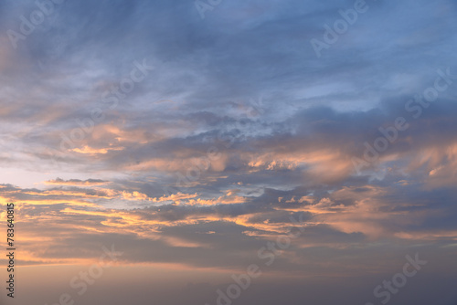 The evening sky, aglow with peach and blue gradients, offers a peaceful ambiance, ideal for backgrounds in artistic projects or sky replacements