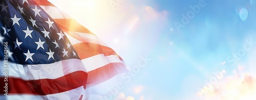 A large American flag is flying in the sky