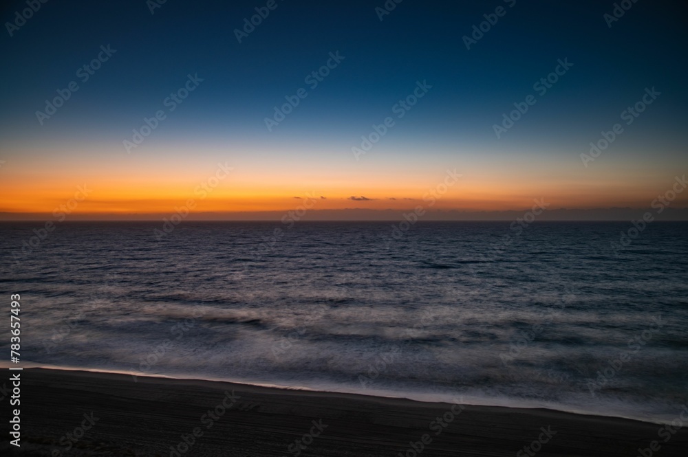 Beautiful shot of a bright sunset sky over the blue sea