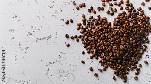 Heart-shaped arrangement of coffee beans with splash on white surface, banner, copy space