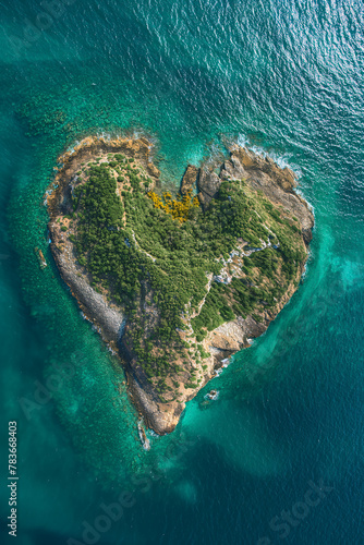 A heart shaped island surrounded by the vast ocean.