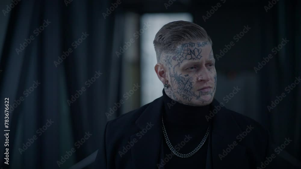 Unconventional Young Man Covered in Tattoos and Dark Black Clothes Unconventional Young Man Covered in Tattoos and Dark Black Clothes