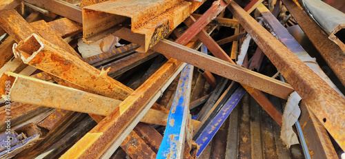 Pile of scrap and rusty iron in industrial institution warehouse