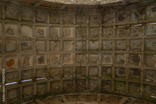 ruins of an abandoned villa in Greek style - ribbed roof vault with remains of painting on a sunny day