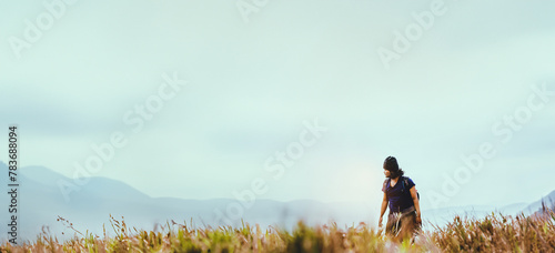Asian man travel  nature. Travel relax.Backpack walk on the meadow in the forest. Thailand