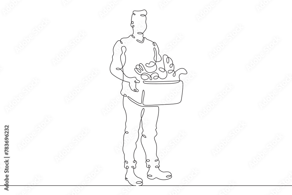 Farmer with products. A man carries a box of vegetables and herbs. Farmer with eco products.One continuous line . Line art. Minimal single line.White background. One line drawing.