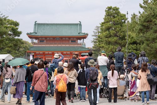 Kyoto Sakura Yosakoi ( Sakuyosa ) festival at the Okazaki area around Heian Shrine. Crowd of people watching the dancing performance and taking pictures. Kyoto, Japan.