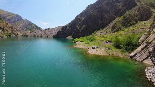 First-person view of the jade Urungach lake in Uzbekistan photo