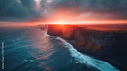 A breathtaking image of Icelandic coastal cliffs against a vibrant sunset sky
