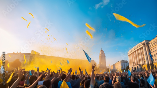 A young beautiful Ukrainian woman holds the Ukrainian flag in her hands, which develops in the wind against the sky, support for the country of Ukraine. 