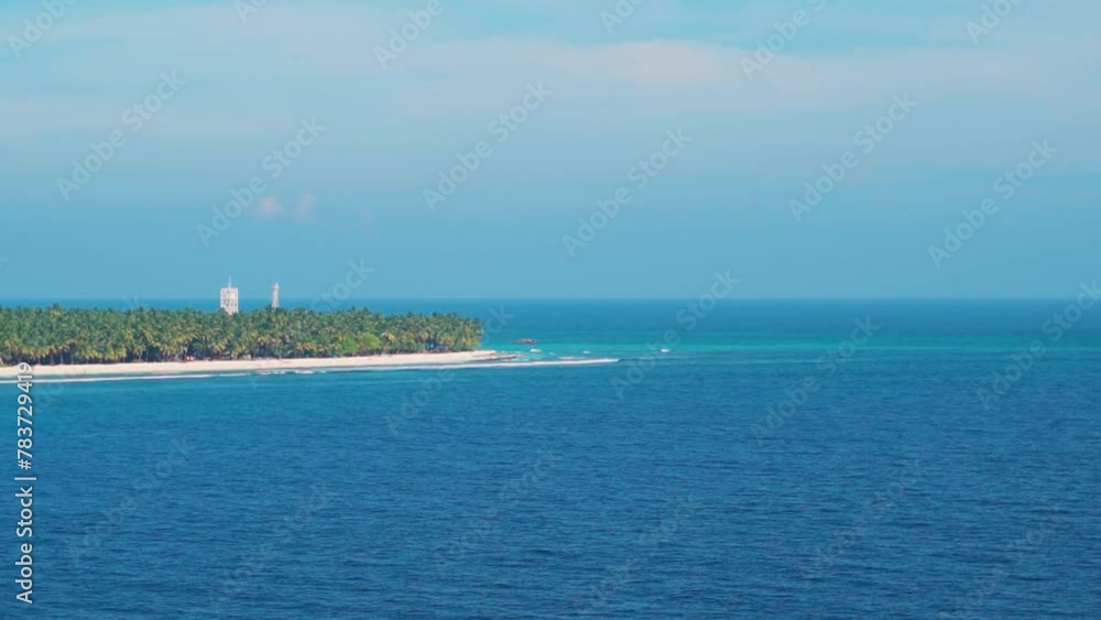 Agatti island in the Union Territory of Lakshadweep, India. Deep blue color ocean water and Island. Travel holidays and tourism concept. Nature landscape. Agatti island in the Union Territory of Lakshadweep, India. Deep blue color ocean water and Island. Travel holidays and tourism concept. Nature landscape.