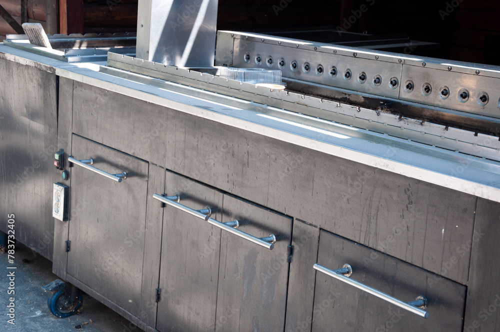 Bar counter in the kitchen. Table fridge or refrigerated table. Electric stove or oven Bar counter in the kitchen. Table fridge or refrigerated table. Electric stove or oven