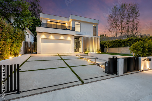 the driveway of this contemporary home in the desert is pictured photo