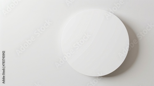 Photorealistic circle paper sticker on white background, top view, spotlight